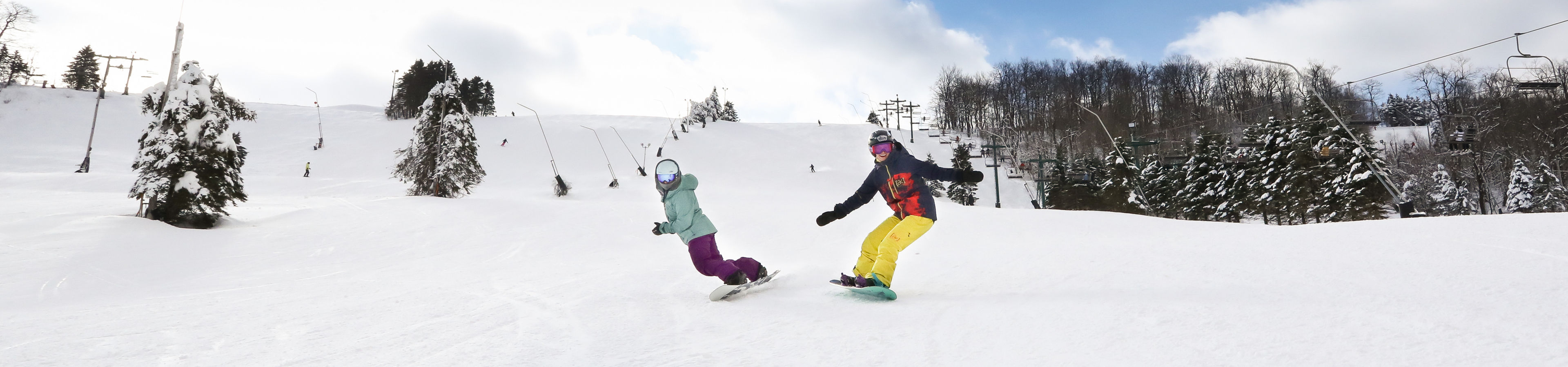 2 female snowboarders on NF