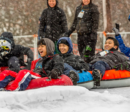 Families and Friends Tubing During Totally Tubular 80's Event at Wilmot Mountain