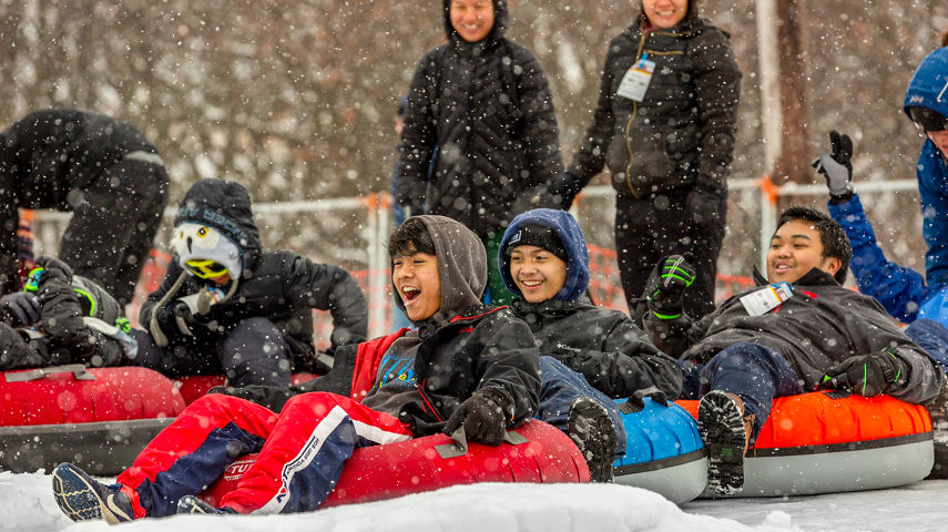Families and Friends Tubing During Totally Tubular 80's Event at Wilmot Mountain