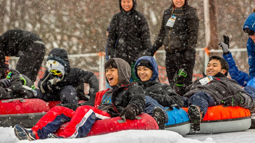 Families and Friends Tubing During Totally Tubular 80's Event at Wilmot Mountain