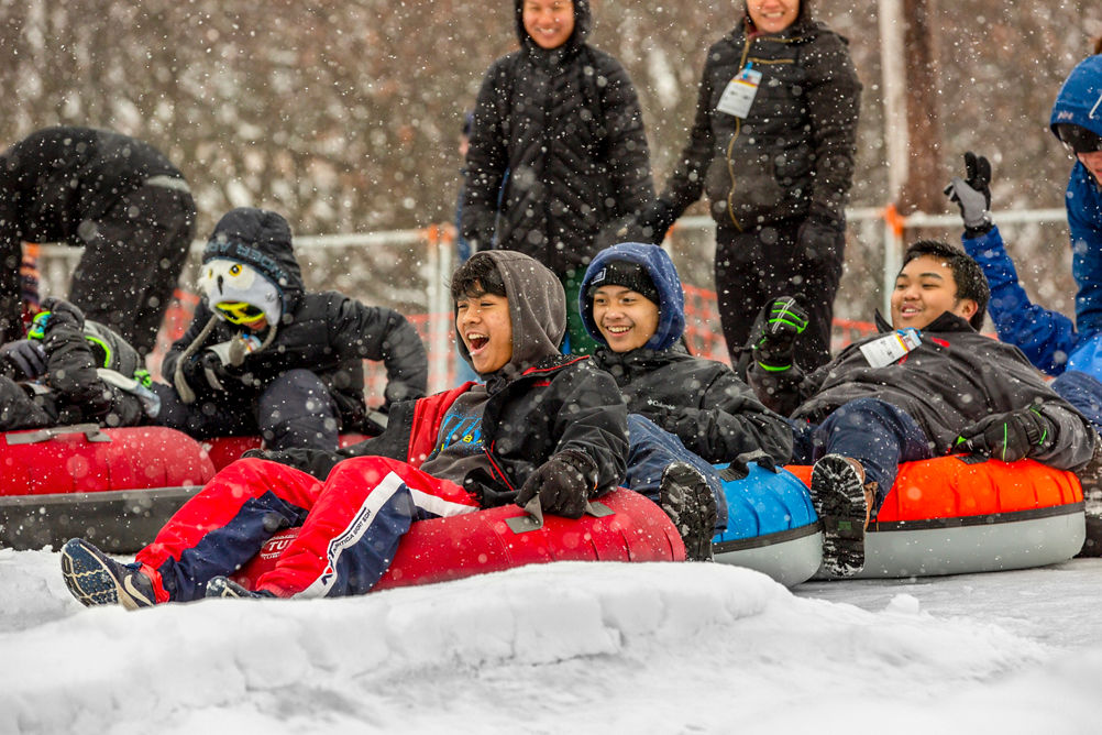 Families and Friends Tubing During Totally Tubular 80's Event at Wilmot Mountain