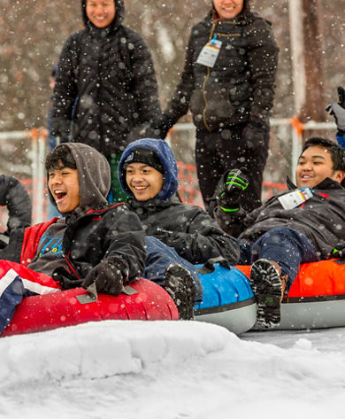 Families and Friends Tubing During Totally Tubular 80's Event at Wilmot Mountain
