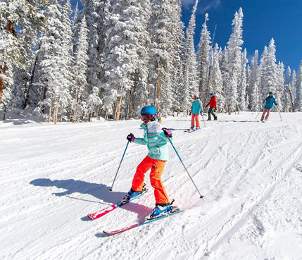 Family Skiing and Riding Together on Vail Mountain