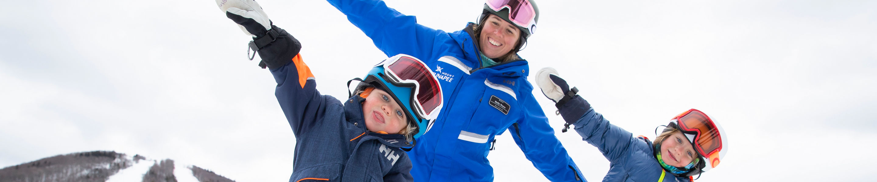Kids Learning How to Ski with Instructor at Mount Sunapee