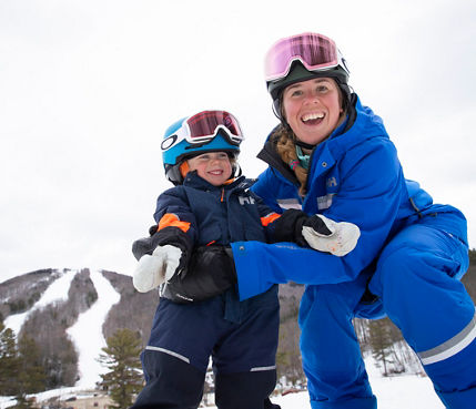 Kids Learning How to Ski with Instructor at Mount Sunapee