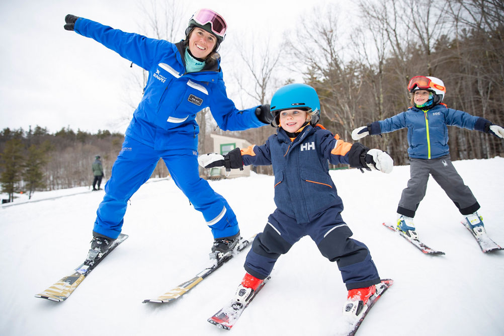 Kids Learning How to Ski with Instructor at Mount Sunapee