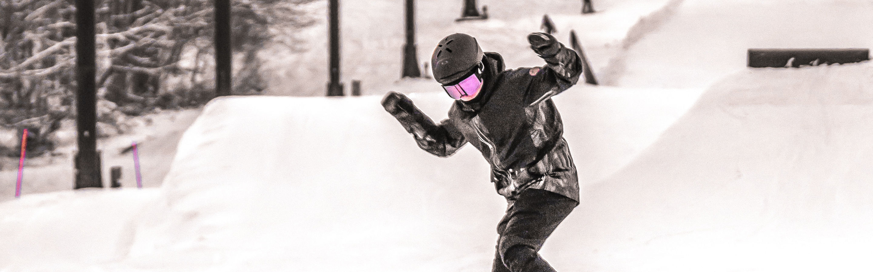 Skiers Hit Jump at Terrain Park at Alpine Valley