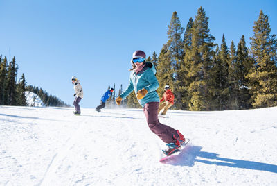 Adult snowboard lesson group at Crested Butte
