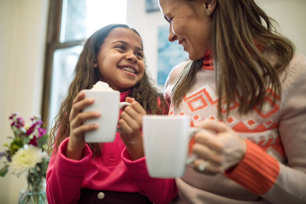 Mom and Daughter Enjoy Hot Chocolate Before Skiing at Beaver Creek