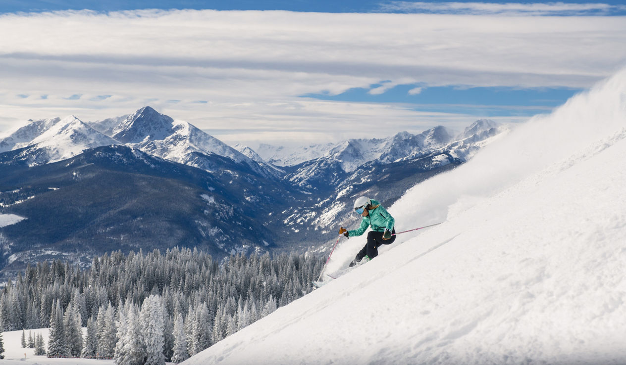 A woman skiing during Powder Day at Vail, CO