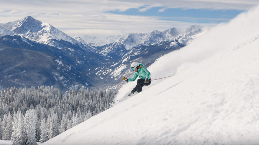 A woman skiing a Powder Day at Vail, CO