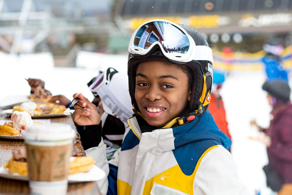 Little Girl Eats Waffle at Base of Hunter Mountain