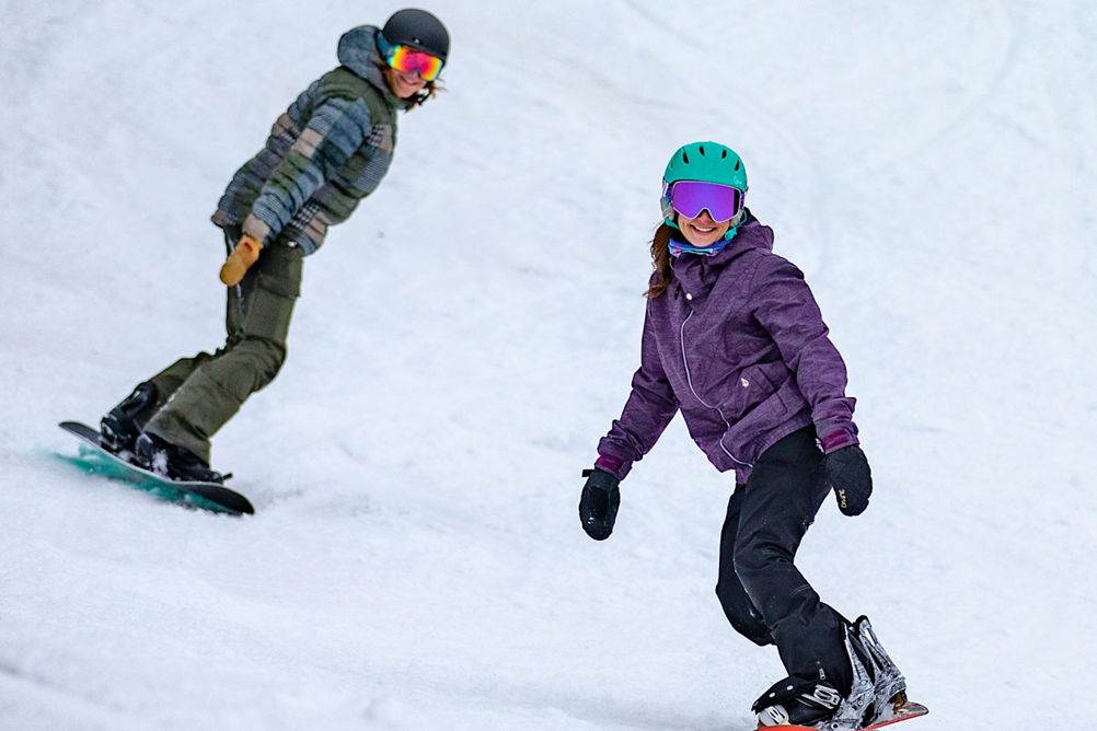 Group Snowboards Downhill at Hunter Mountain