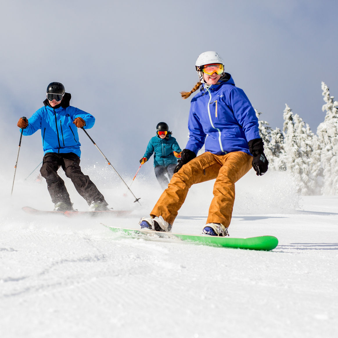 Group of Skiers and Riders on Ski Run at Mount Snow