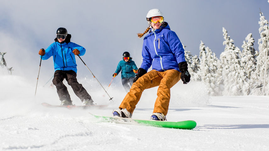 Group of Skiers and Riders on Ski Run at Mount Snow