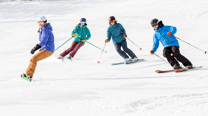 Group of Skiers and Riders on Ski Run at Mount Snow