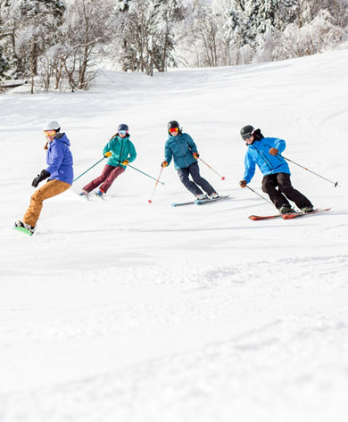 Group of Skiers and Riders on Ski Run at Mount Snow