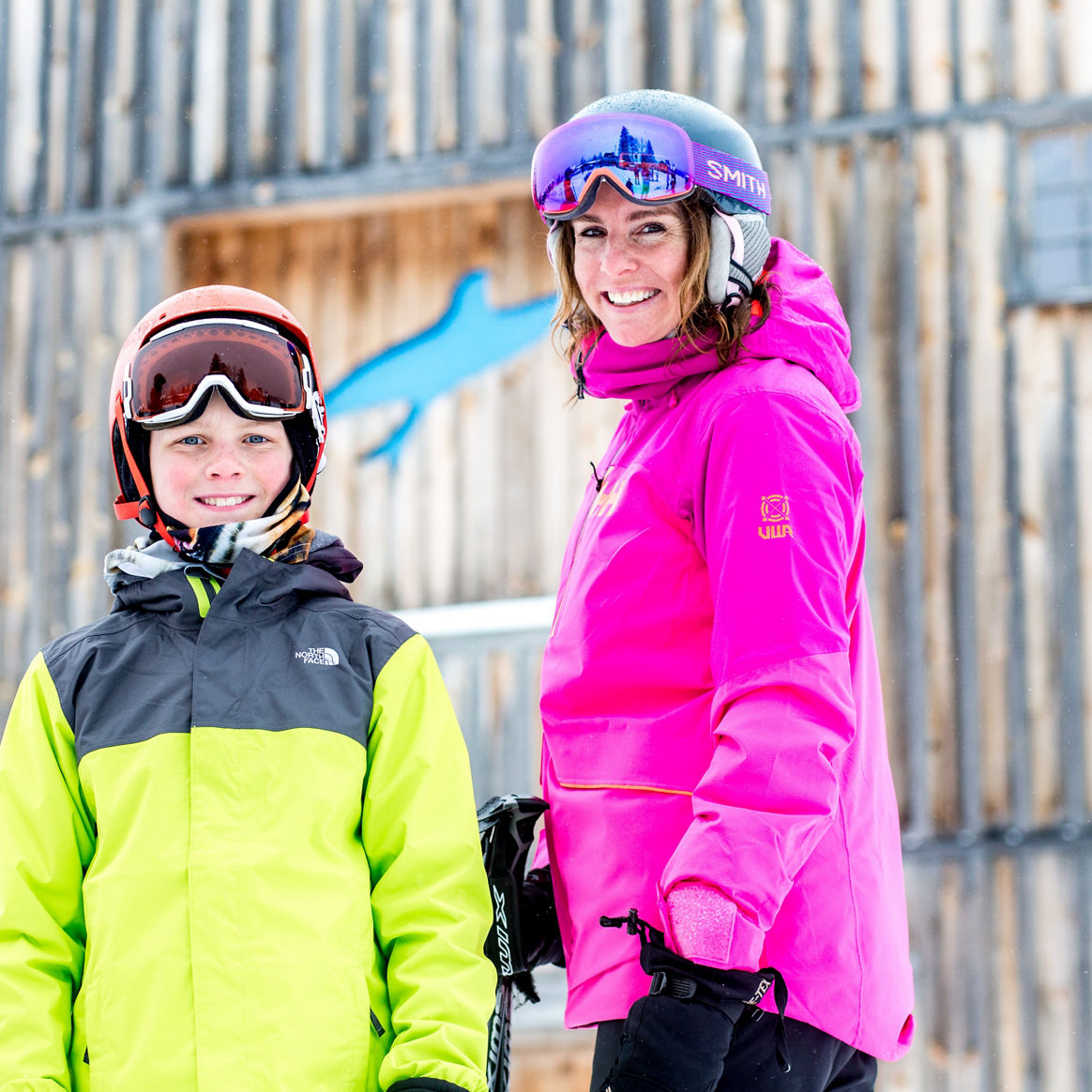Mother and Son Smile in Front of Bluebird Barn