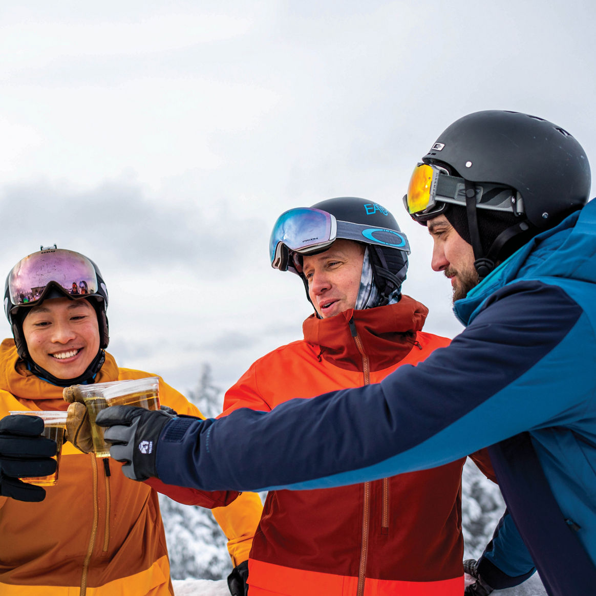 Group of Men Drink Beer Apres Ski on Deck at Mount Snow