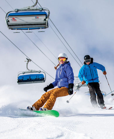 Group of Skiers and Riders on Ski Run at Mount Snow