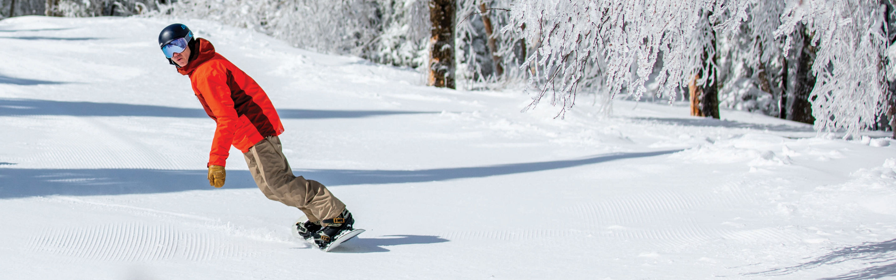 Snowboarder Makes Turns on Ski Run at Mount Snow