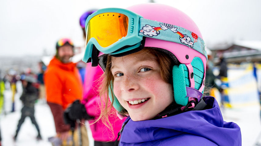 Girl Smiles in Line for Bluebird Express