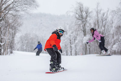 Snowboarders Make Turns on Ski Run at Mount Snow