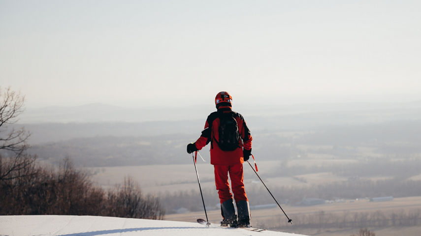 Skier Looks Out Over the Horizon at Liberty Mountain