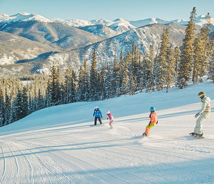 Snowboard lesson riding down Keystone Resort