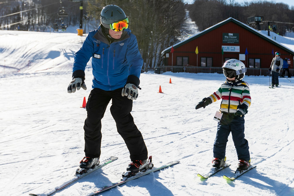 Ski Instructor Helps Little Boy Learn How to Ski at Mount Snow