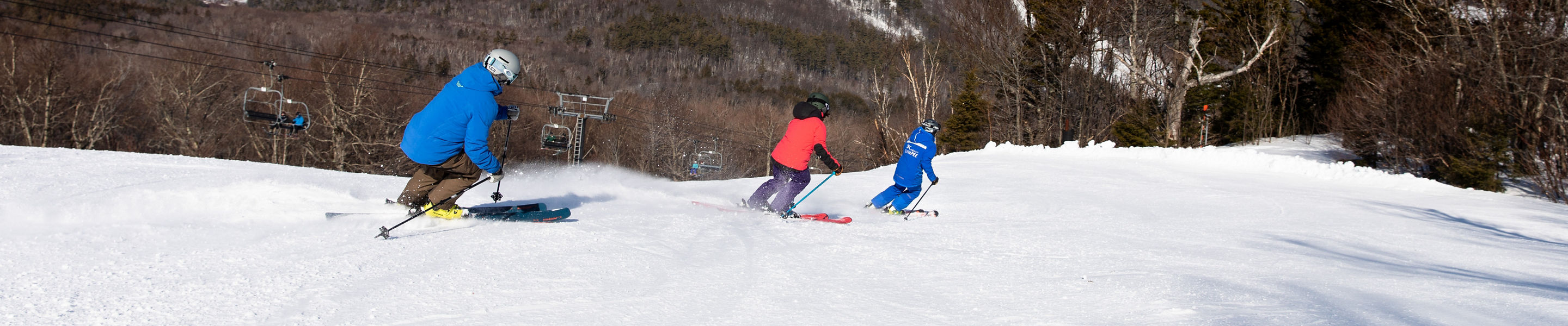 Two Adults Skiing with Instructor  at Mount Sunapee