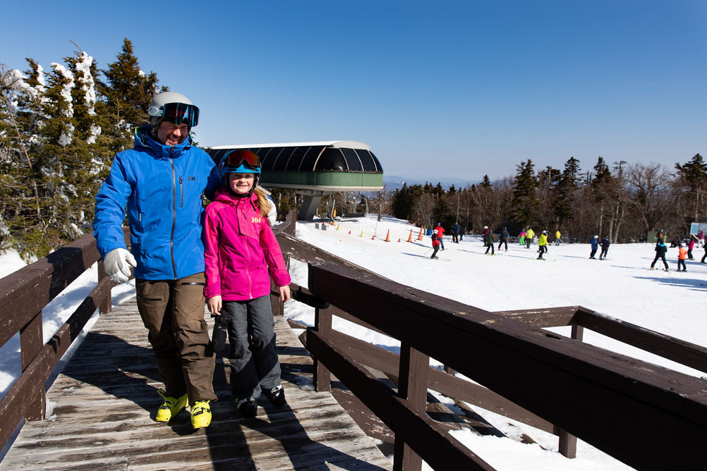 Father and Child Walking up Ramp at Summit  at Mount Sunapee