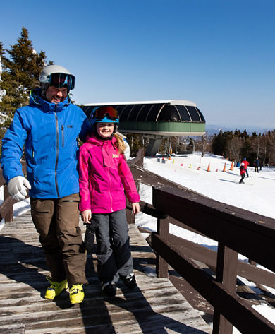 Father and Child Walking up Ramp at Summit  at Mount Sunapee