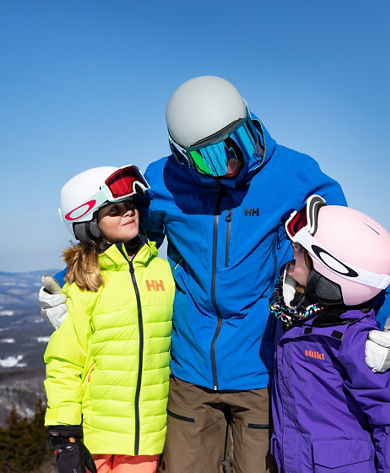 Father Hugging Two Children  at Mount Sunapee