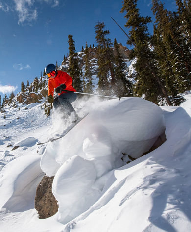Skiier popping off pillow in Third Bowl of Crested Butte