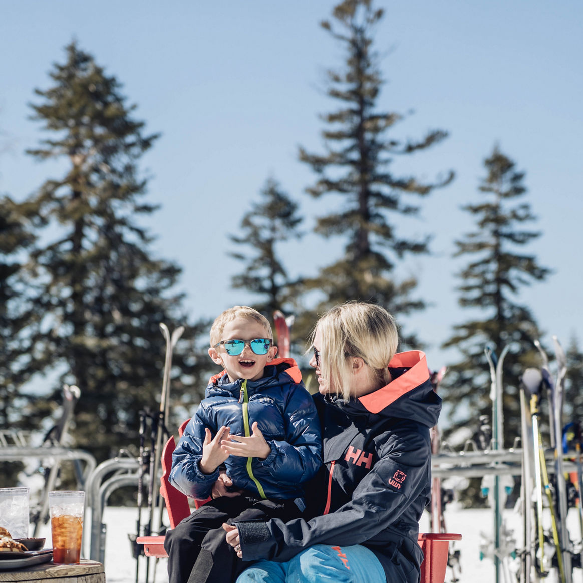 Child Sits on Mother's Lap During Lunch at Northstar California Resort