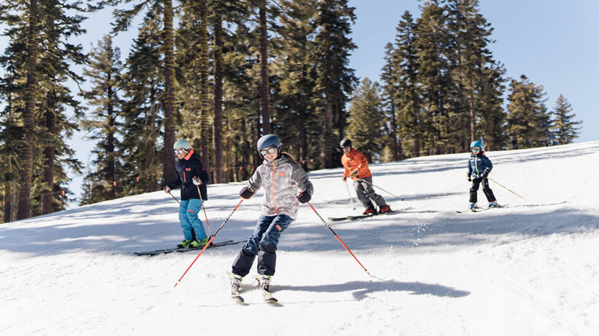 Daughter leads Family Down East Ridge on a Spring Day at Northstar California