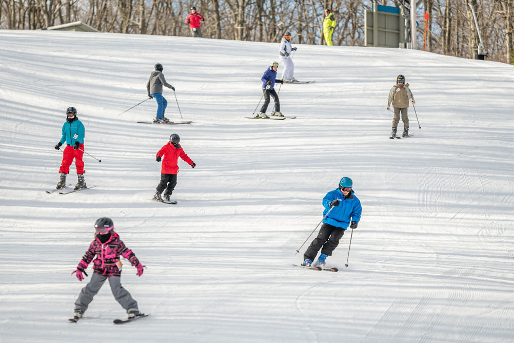 Skiers Make Turns Downhill at Jack Frost