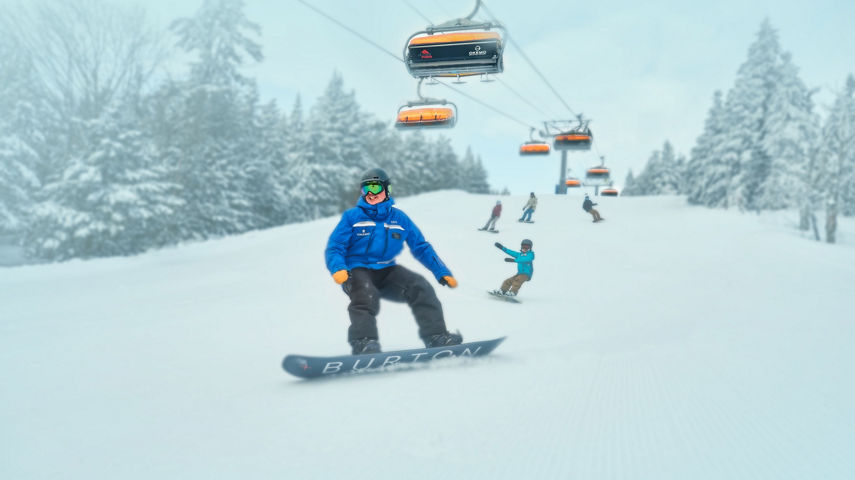 Family Following Instructor Down Trail Under Sunburst Six at Okemo