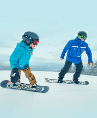Instructor and Boy Snowboarding at Okemo