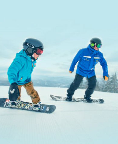 Instructor and Boy Snowboarding at Okemo