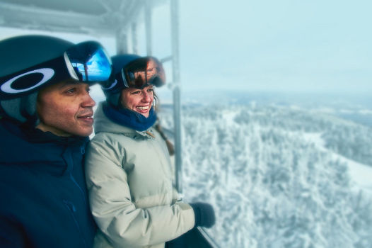 Two Adults Admiring View from Fire Tower at Summit at Okemo