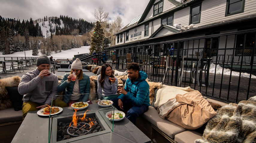 Friends eating on the deck at Mid Mountain Lodge at Park City