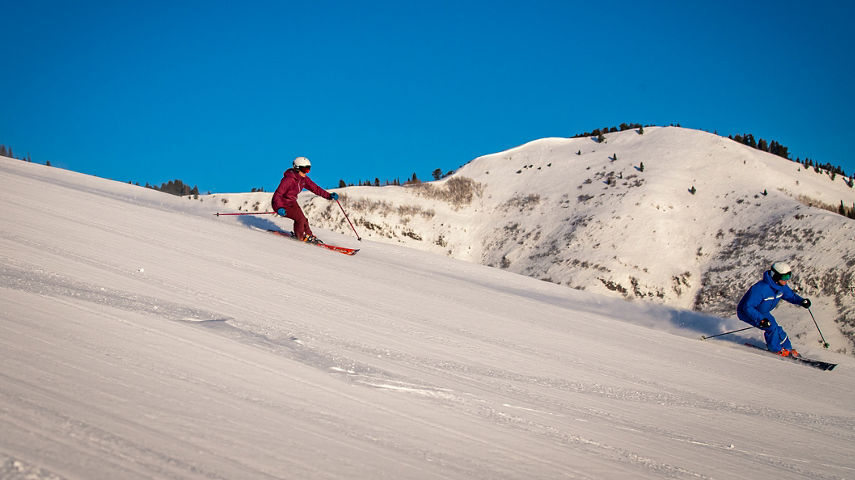 Adults skiing with an instructor at Park City