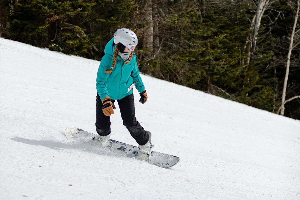 Snowboarder Makes Turns on Ski Run at Mount Snow