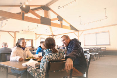 Family Eating Lunch Inside Lodge at Okemo