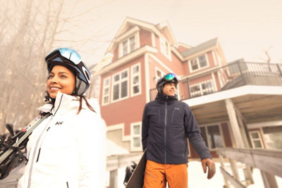 Husband and Wife Walking from Condo to Trails at Okemo