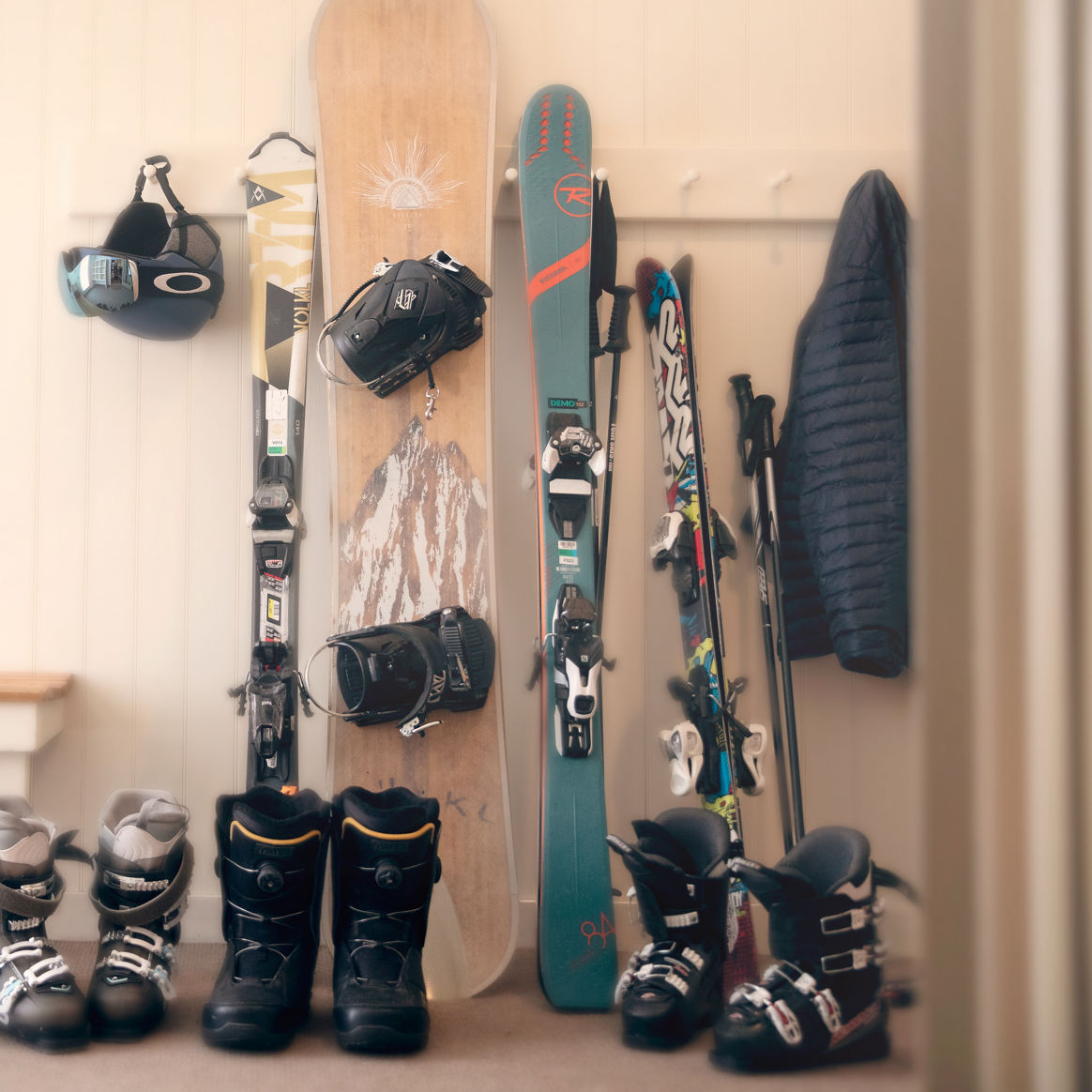 Ski and Snowboard Gear Lined Up Near Door at Okemo