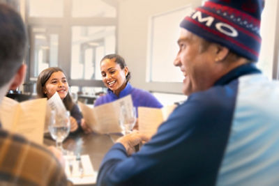 Family Looking at Food Menus at Okemo