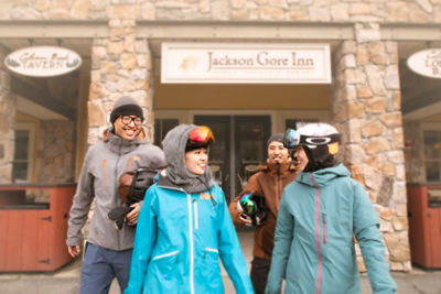 Group of Friends Walking and Talking in Base Area at Okemo